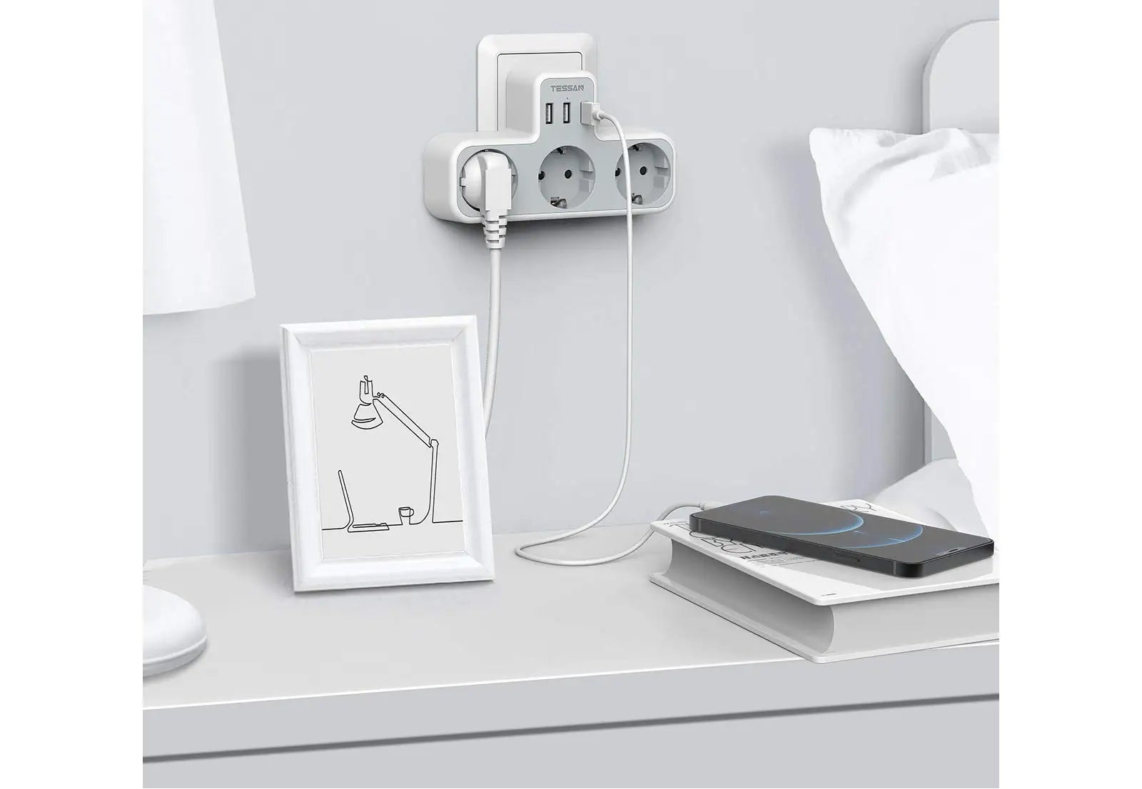 Wall-mounted power strip with multiple outlets and USB ports in a bedroom setting.