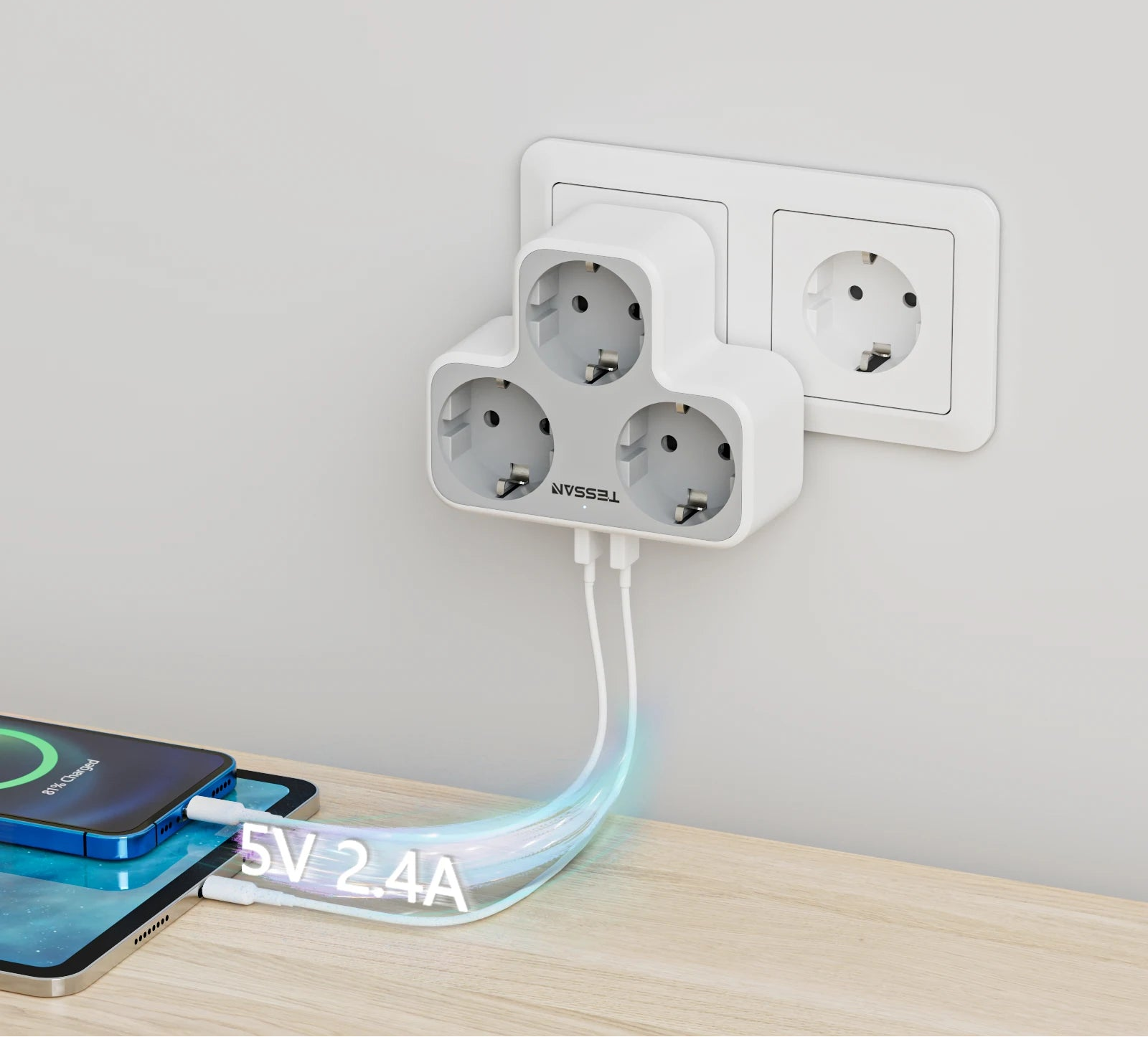 Multiple power outlets with a cable plugged into one, on a light wooden surface.